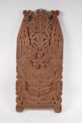 An Indonesian Dayak people hardwood carved panel with figural decoration, 26cm x 56cm