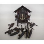 A vintage Black Forest cuckoo clock with weight driven movement, for restoration