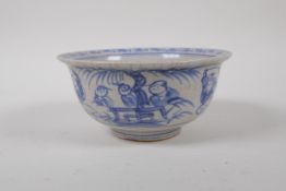 A Chinese blue and white crackle glazed porcelain rice bowl decorated with boys at play, 14cm