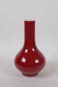 A Chinese sang de boeuf porcelain bottle vase, 18cm high