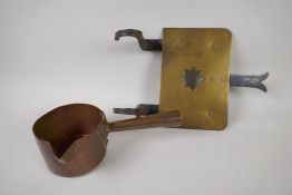A late C18th/early C19th copper sauce pan, 11.5cm diameter, and an C18th brass and iron trivet