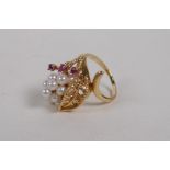 A 14ct yellow gold, ruby and seed pearl ring with a unique cornucopia design, size K/L, unmarked