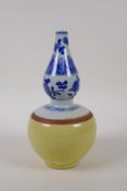 A Chinese blue and white porcelain double gourd stem vase with a yellow glazed base, 21cm high