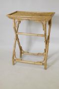 A mid century bamboo butler's tray and folding stand, 66 x 44 x 83cm