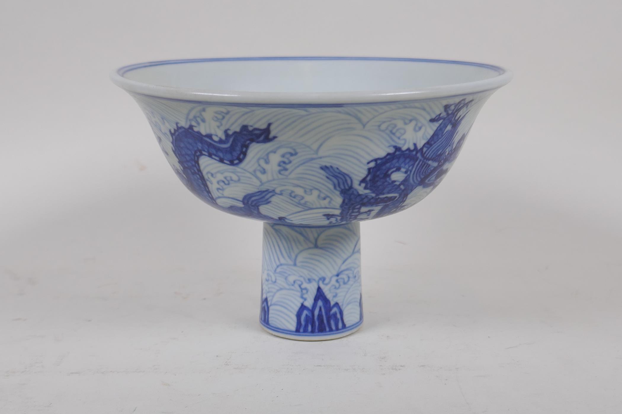 A blue and white porcelain stem bowl with dragon decoration, Chinese Xuande 6 character mark to - Image 4 of 6