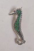 A 925 silver sea horse brooch, set with green and red stones, 5cm long