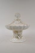 A C19th Minton Parian ware bonbon dish in the form of a satyr holding a shell, 22cm high