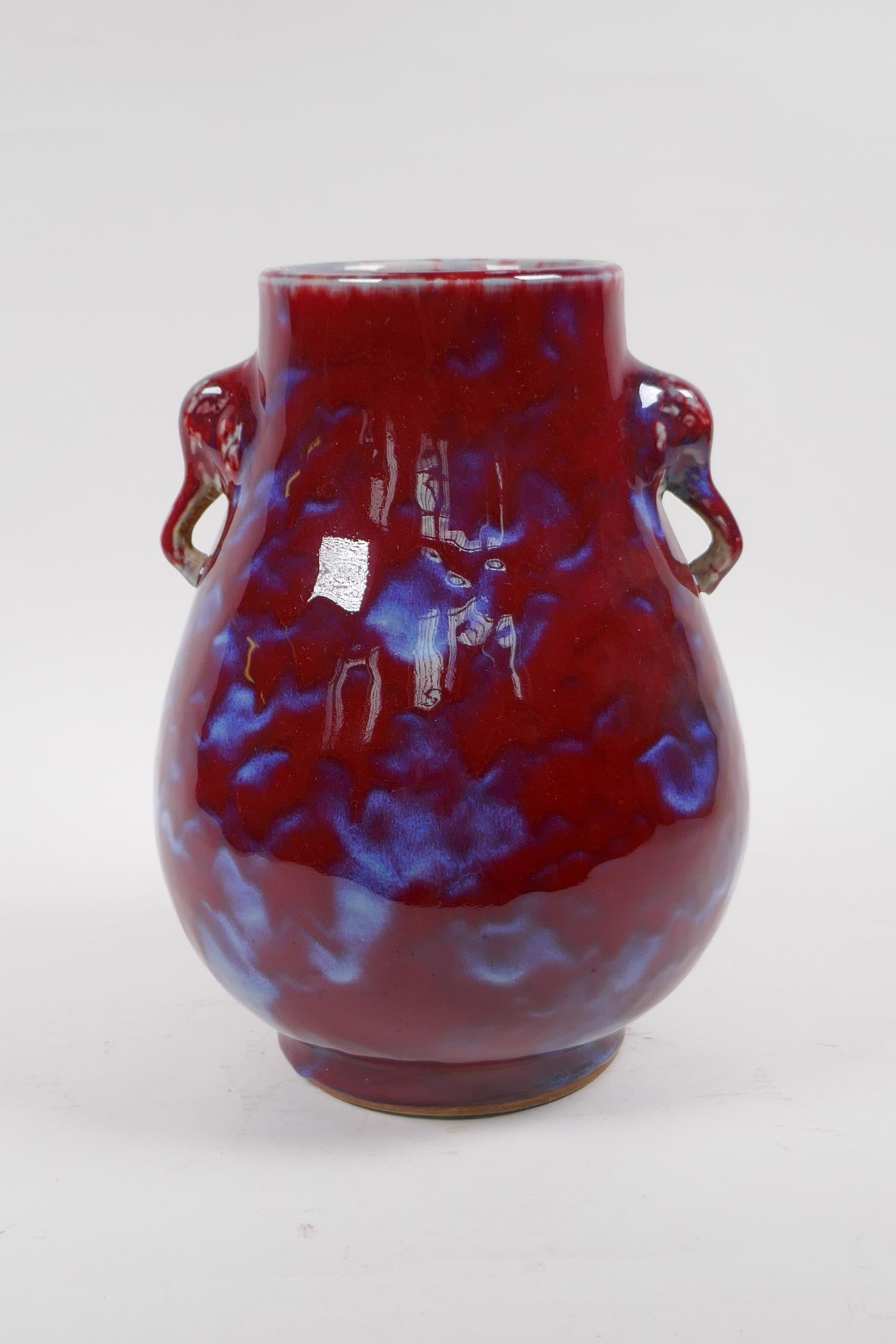 A Chinese blue and red flambe glazed porcelain vase with two elephant mask handles, 27cm high - Image 3 of 5