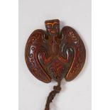 An Oriental moulded pendant in the form of a bat, 6 x 6cm