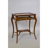 An Edwardian satinwood serpentine top bijouterie table, raised on shaped supports united by an