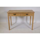 Early C19th stripped pine two drawer side/writing table with brass plate handles, raised on square
