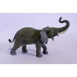 A cold painted bronze figure of an elephant, after Bergman, impressed mark to base, 35cm long