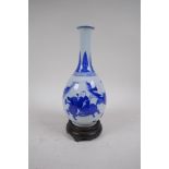 A C19th blue and white porcelain bottle vase decorated with boys playing, Chinese Qianlong 6