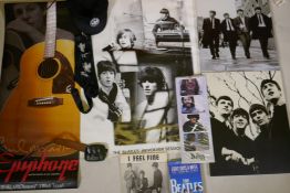A collection of Beatles memorabilia including an Apple Corp. cap, Revolver album poster, Lennon