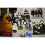 A collection of Beatles memorabilia including an Apple Corp. cap, Revolver album poster, Lennon