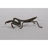 A Japanese Jizai style bronze okimono praying mantis, 9cm long