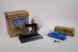 A Triang No 2 Minic Clockwork musical car, in original box, and a vintage Little Betty child's
