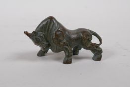 A bronze ornament of a bull, 8cm long