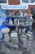 A collection of stoneware garden ornaments and pedestals etc, including figures, gnomes, animals