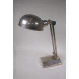 A polished metal adjustable desk lamp from John Lewis, 43cm high