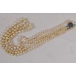 A pearl two string necklace with sterling silver clasp, 44cm long