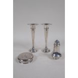 A pair of hallmarked silver bud vases by Sanders and Mackenzie, Birmingham 1964, gross 148g, with