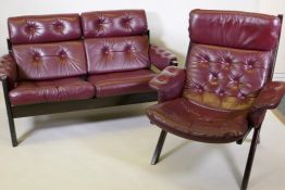 A mid century stained wood frame two seater settee with buttoned leather seats and back, 127cm, 85cm