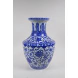 A blue and white porcelain vase with scrolling lotus flower decoration, Chinese Qianlong seal mark