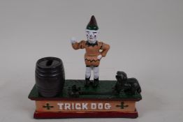 A cast iron trick dog money box