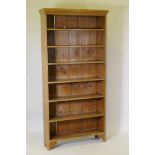 An antique pine open bookcase with fixed shelves, 95 x 24 x 194cms