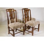 Four early C19th mahogany Chippendale style chairs with pierced splats, raised on square supports