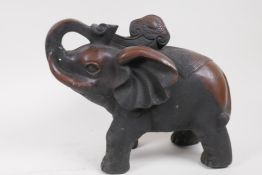 A bronze figure of an elephant in elaborate costume, 25cm high