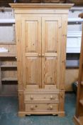 A pine two door wardrobe, with two drawers to the base, 100 x 68cm, 199cm high