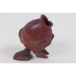 A Japanese carved hardwood posey vase in the form of a fish, signed, 7cm high