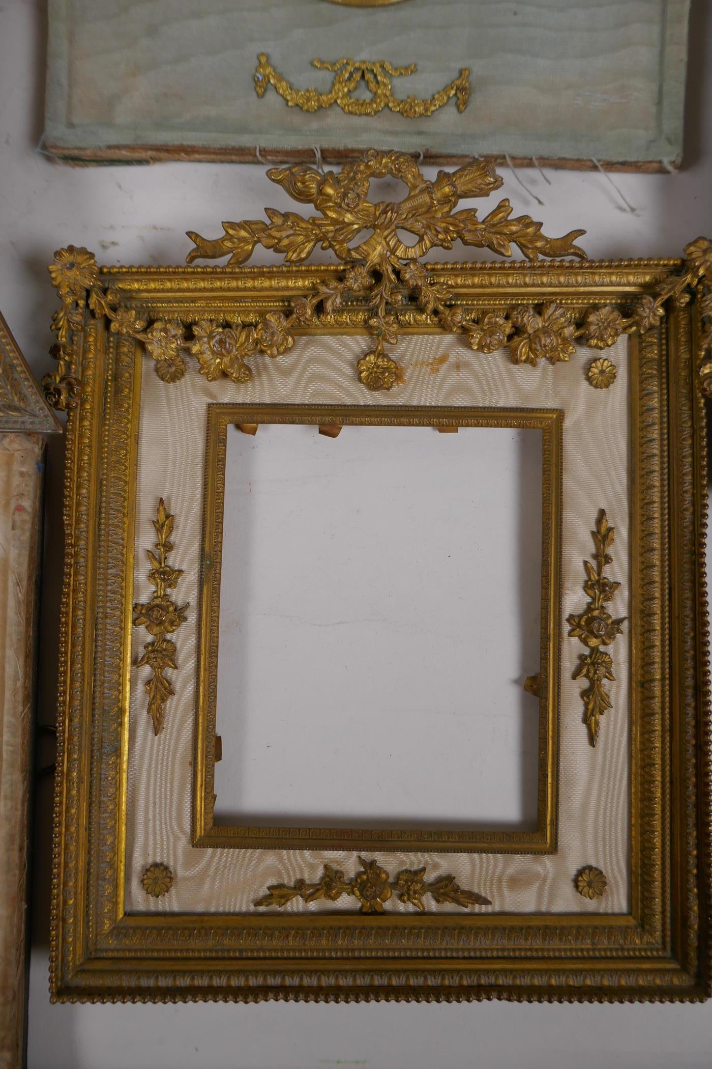 A brass and ormolu photo frame with Empire style decoration and watered silk border, late C19th/ - Image 4 of 5