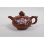 A Chinese YiXing teapot with polychrome enamel floral decoration, marks to base, 12cm diameter