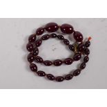 A cherry amber graduated bead necklace, 39cm long, clasp AF