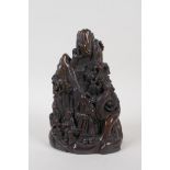 A Chinese faux horn carving of two figures in a mountain landscape, character mark to base, 19cm