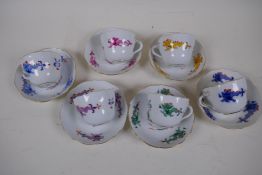 A harlequin set of six Meissen Cabinet cups and saucers painted with dragons