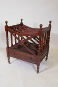 A mahogany canterbury with single drawer and brass castors, 49 x 39cms, 61cm high