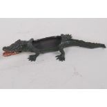 A cold painted bronze pin tray in the form of a crocodile, 22cm long