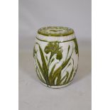 A Wardle majolica garden seat with raised olive green glazed lily decoration, 47cm high, 36cm dia