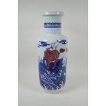 A Chinese blue and white porcelain rouleau vase with red mythical creature decoration, 45cm high