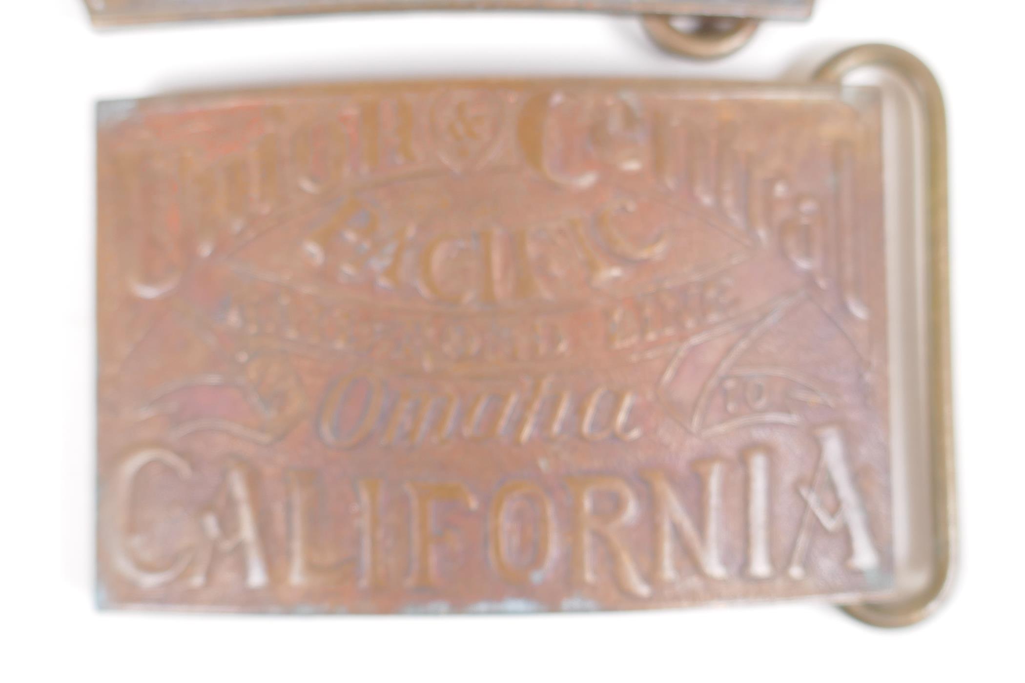 A pair of Tiffany style brass belt buckles advertising 'Wells Cargo' and 'Union Central', 9 x 6cm - Image 3 of 3