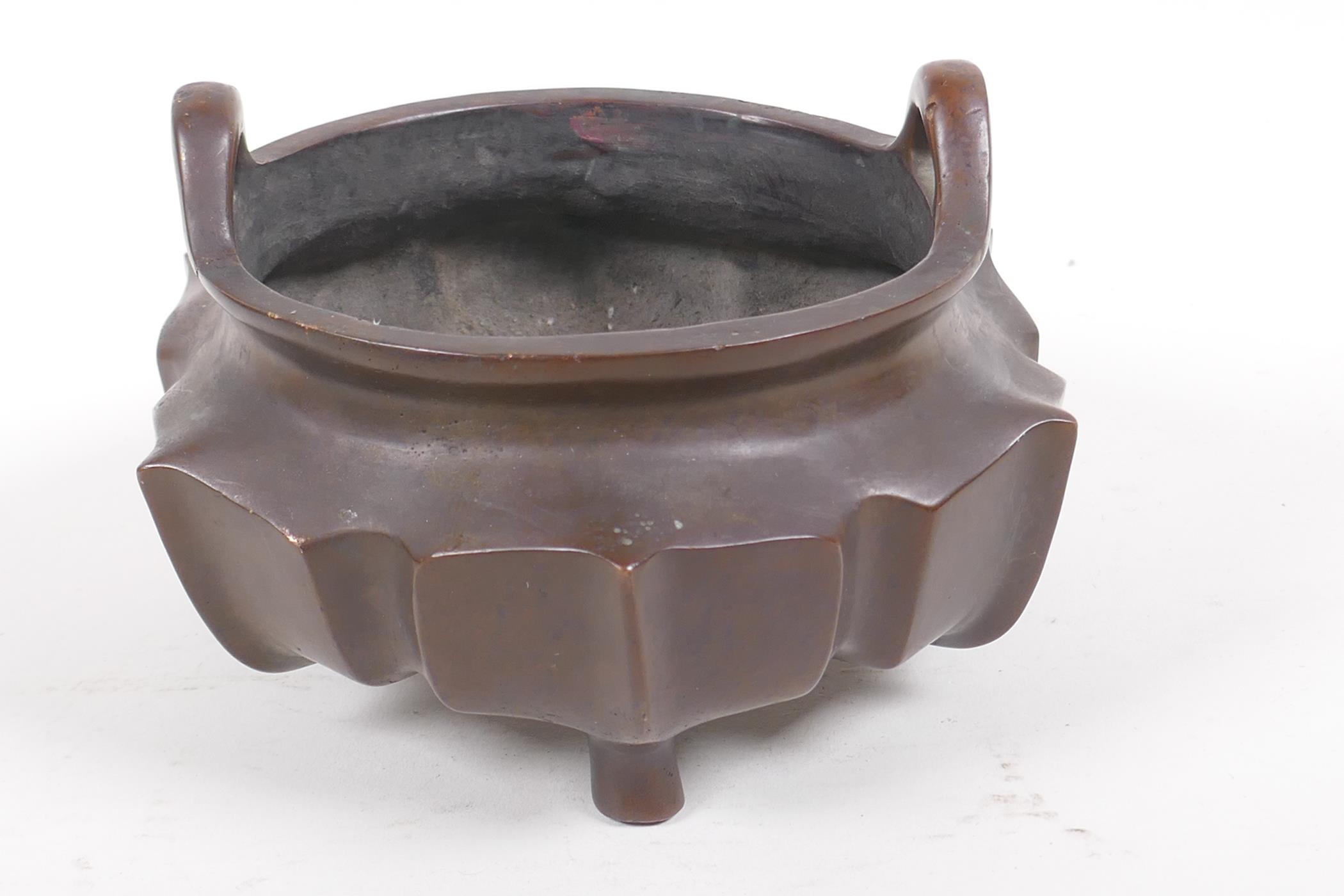 A Chinese lotus flower shaped bronze censer with loop handles on tripod supports, impressed - Image 3 of 5