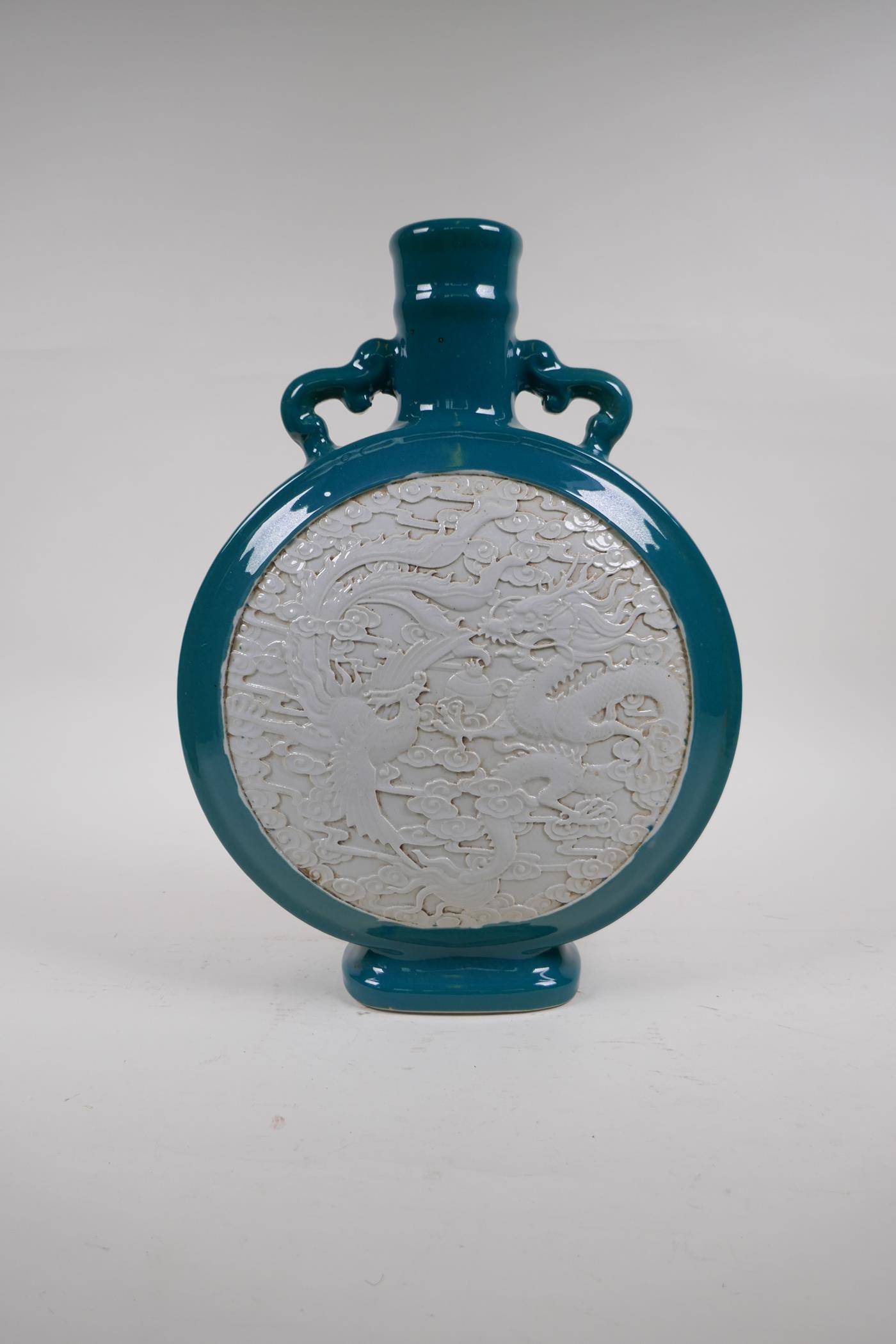 An emerald green glazed porcelain two handled moon flask with a white ground panel and raised dragon - Image 4 of 6