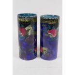 A near pair of Rubens ware cylindrical vases decorated by F.X. Abraham, 17cm high