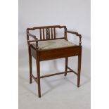 An Edwardian mahogany piano stool with boxwood and burr walnut inlaid decoration and lift up seat,