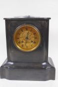 A marble cased mantel clock with French two train movement striking on a bell, with engraved