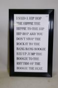 A contemporary framed and painted fretwork of the lyrics to Rappers' Delight, The Sugar Hill Gang,